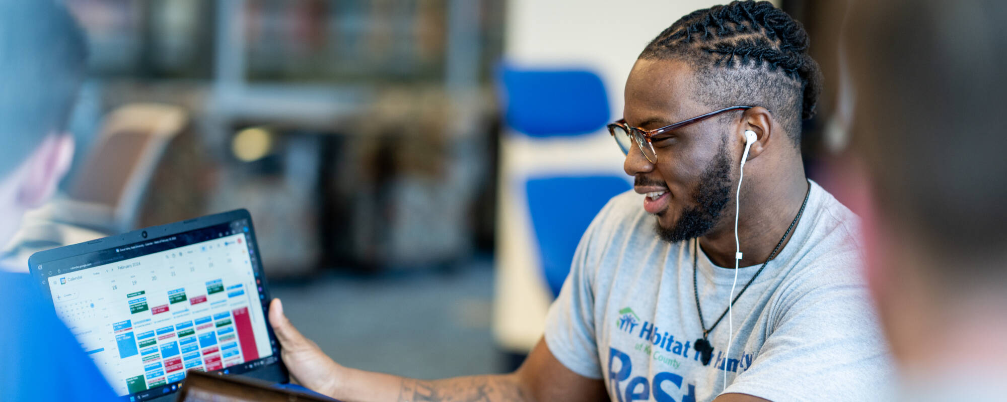 Junior biomedical science major Alen Pope shows friends his packed schedule during a study session in Mary Idema Pew Library.